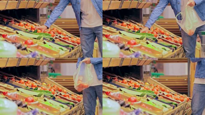 男人把西红柿放在商店的包装里。在超市买菜。特写。