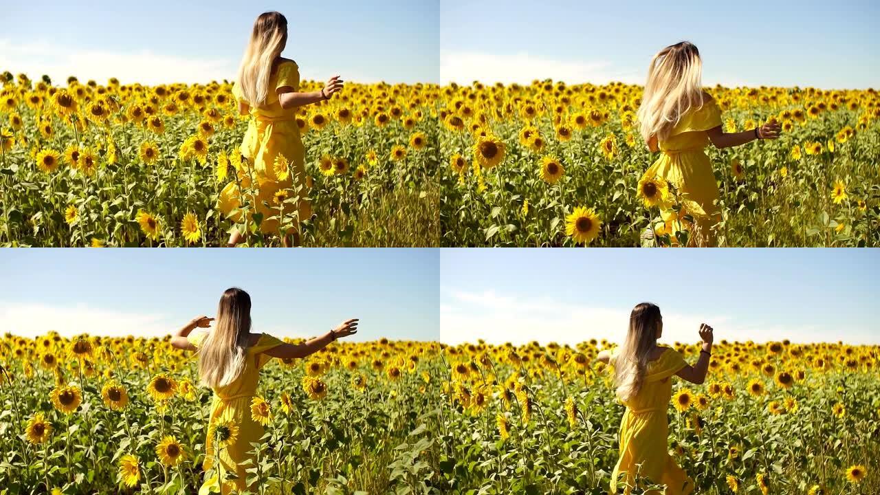 一个穿着黄色连衣裙的年轻女孩穿着向日葵穿过田野。慢动作