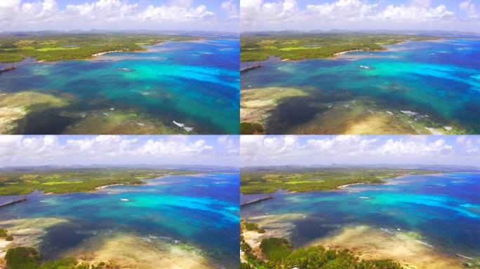 鸟瞰图热带海滩岛和海湾泻湖，Siargao。热带景观丘陵和山岩与雨林棕榈。