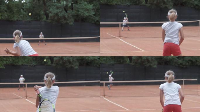 网球，体育运动员少年女孩与对手在球上击中球拍，在比赛期间通过球网相互传递