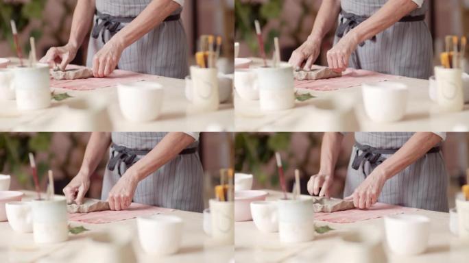 制作陶器的女性手