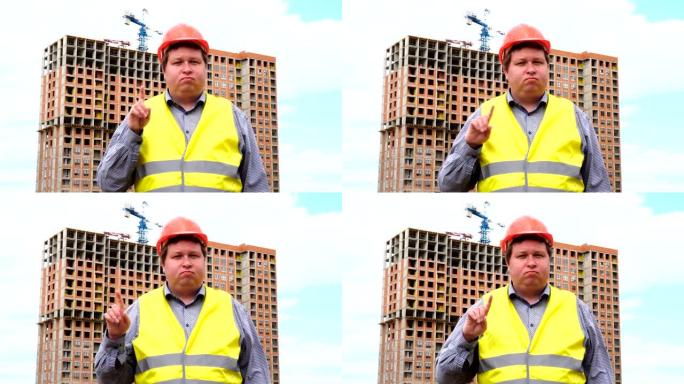 建筑工地上的男性建筑工人工头，工人或建筑师不同意挥舞手指。