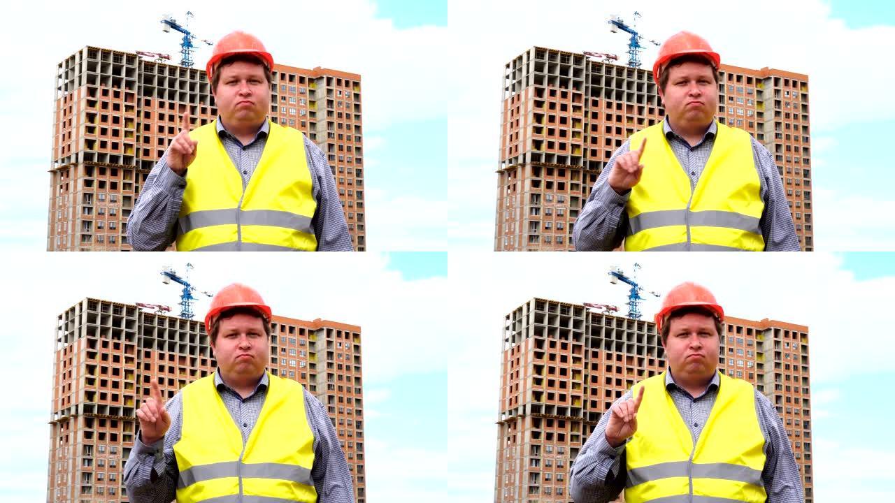 建筑工地上的男性建筑工人工头，工人或建筑师不同意挥舞手指。