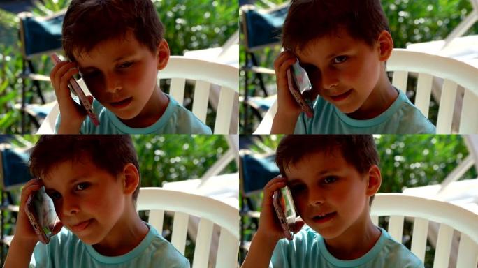 棕色眼睛的男孩听电话