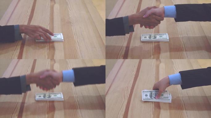 商人把一捆钱给另一个人，并握手