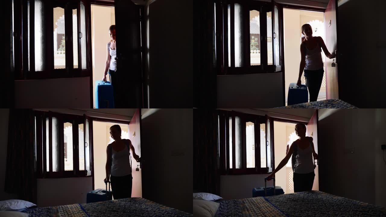 单身女性入住酒店房间打开门，然后进入房间。