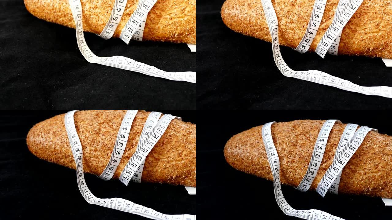 健康的麸皮面包和卷尺，全麦面包，