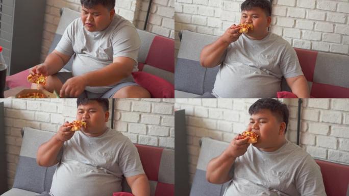 胖子对吃披萨和软饮料很满意。