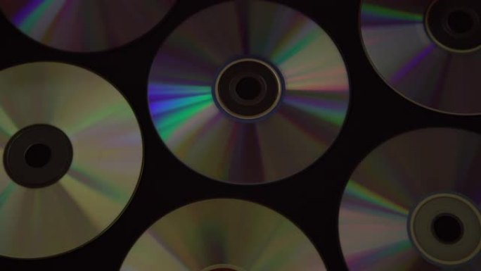 老式光盘或DVD光盘背景，用于数据存储的旧圆形光盘，共享电影和音乐