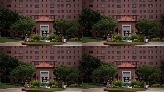建立红色砖砌古巴地中海风格医院入口的镜头