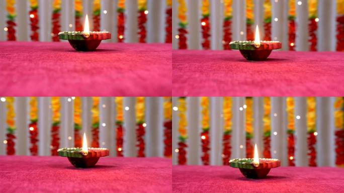 在Raksha Bandhan或排灯节之际，向上倾斜燃烧的diya镜头