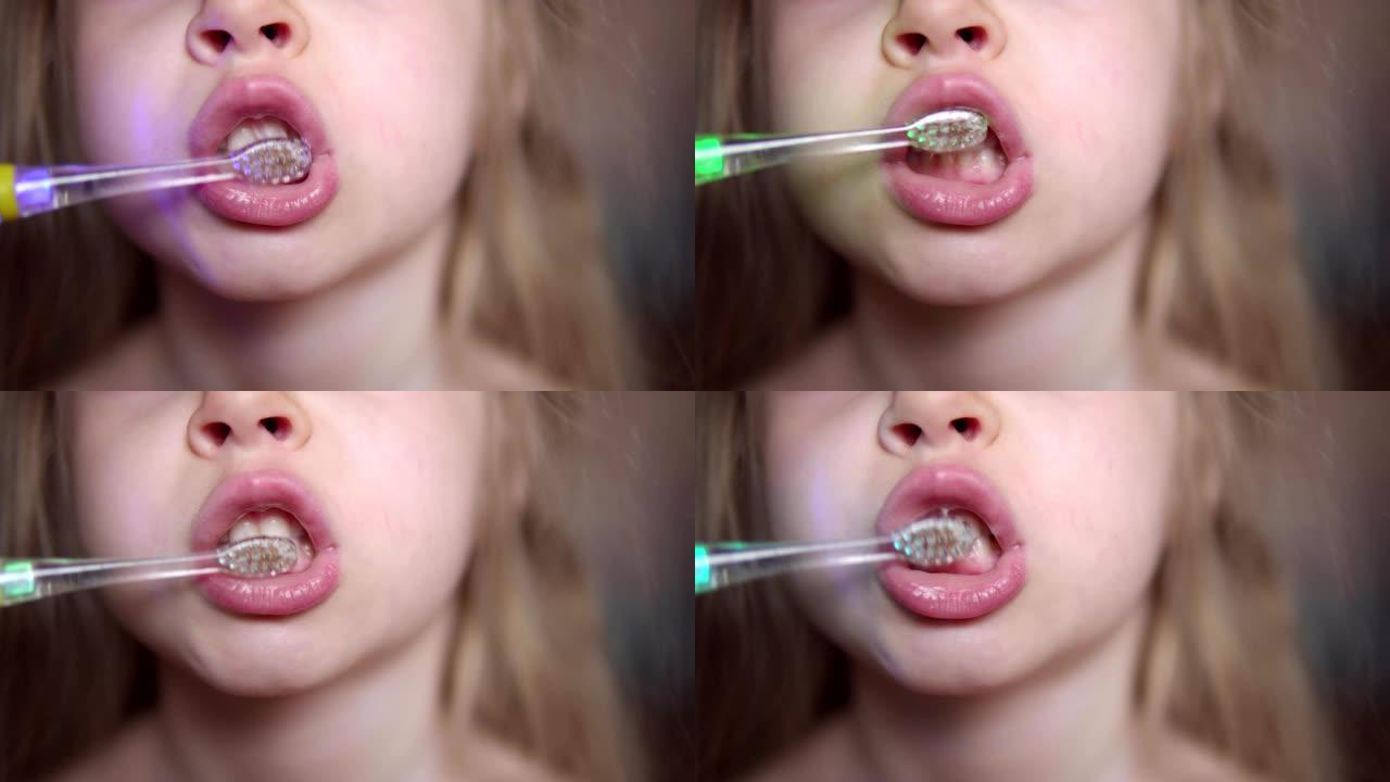 孩子用电动牙刷刷牙。