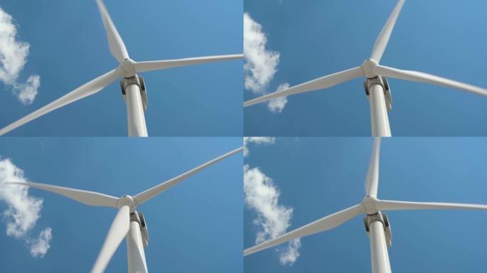 明亮多云天空背景下的风力发电机