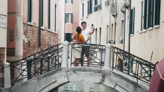 年轻的亚洲成年夫妇在意大利威尼斯自拍