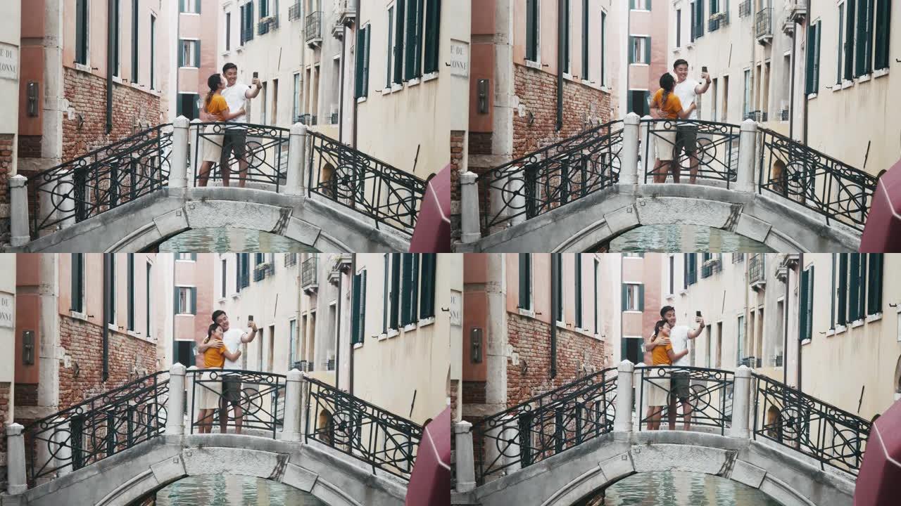 年轻的亚洲成年夫妇在意大利威尼斯自拍