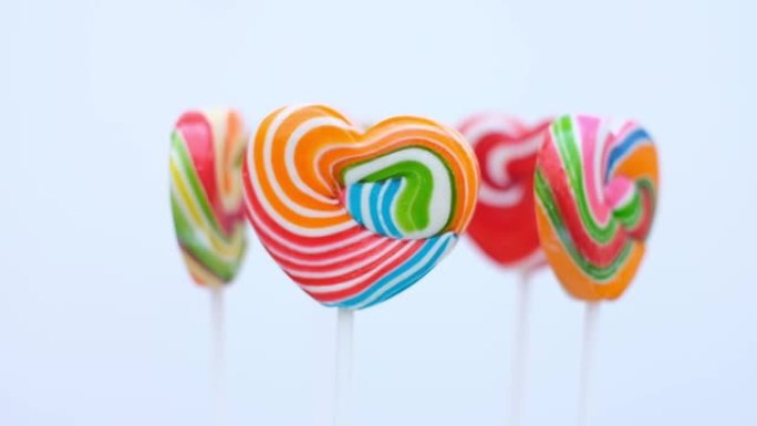 糖果心形彩色全圆旋转，套装彩色彩虹棒棒糖，情人节爱情概念礼物