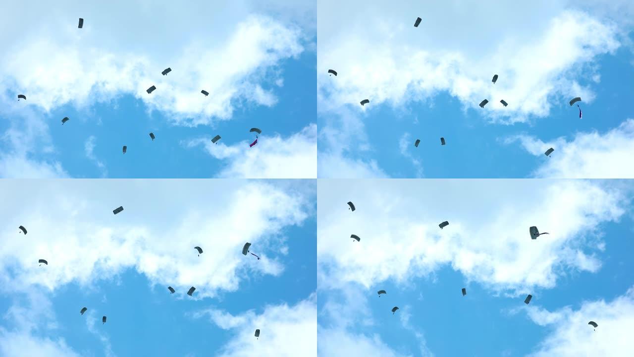 跳伞者在喜怒无常的天空中玩耍，剪影