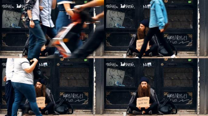 无家可归的人拿着 “同情我” 的纸板，在拥挤的街道上乞讨