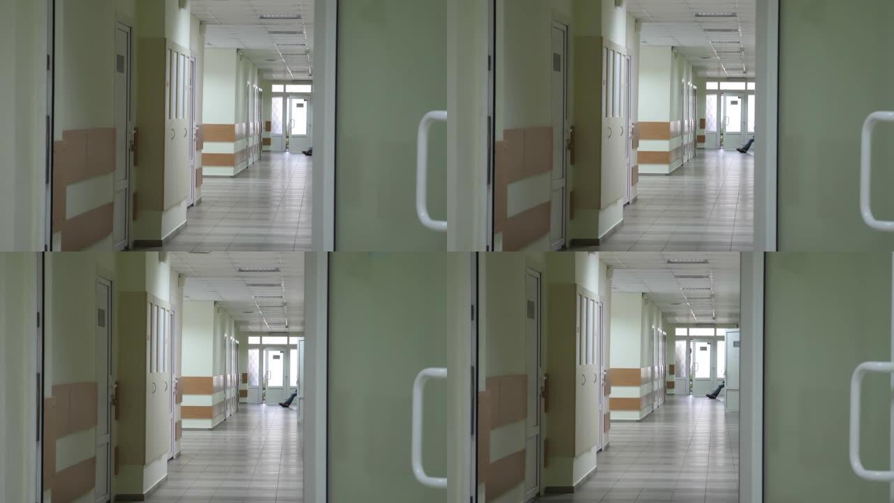 医院有绿色门的空走廊