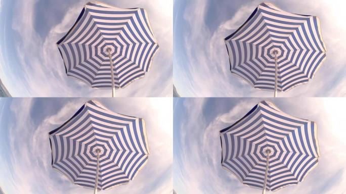 克罗地亚海岸上的独身海滩复古风格雨伞。鱼眼视图。