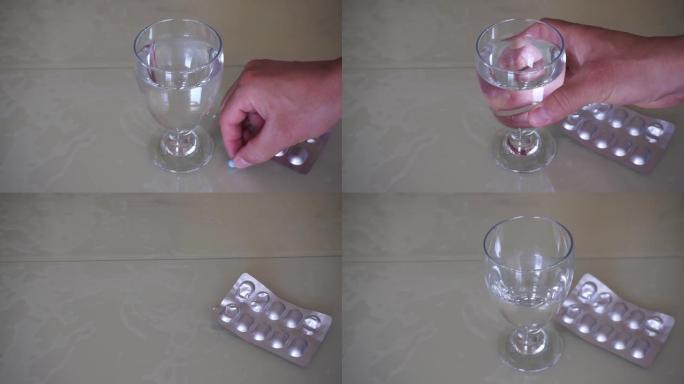 一杯水和强制性药丸，用一杯水喝药丸，
