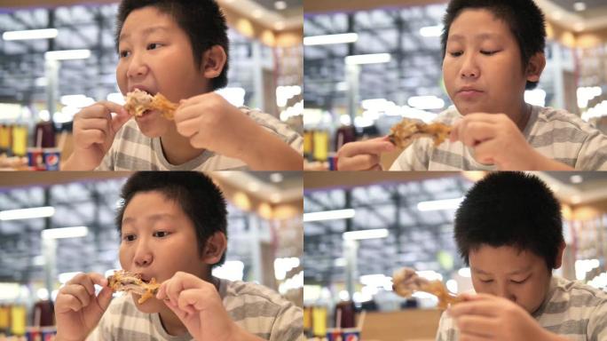 亚洲孩子喜欢和家人在餐馆吃炸鸡。