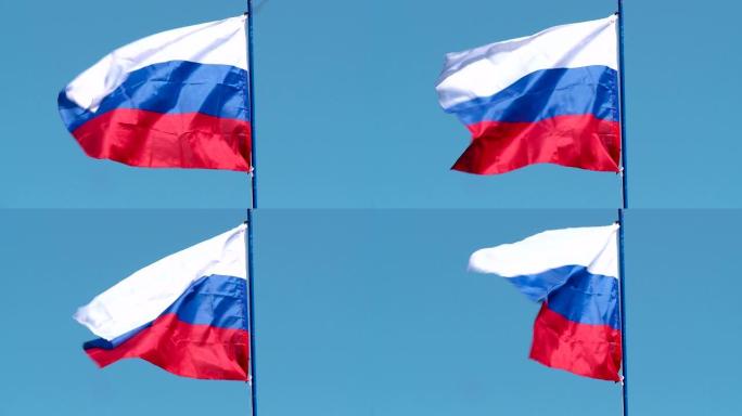 迎风迎着夏日蓝天的俄罗斯国旗