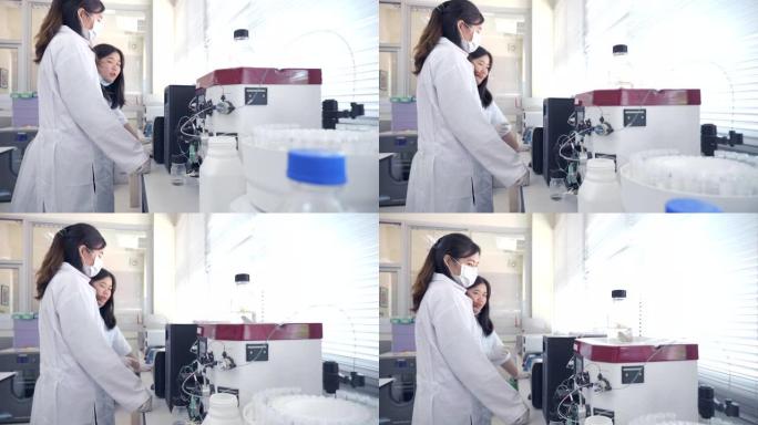 两名科学家在实验室使用蛋白质纯化的场景慢动作，实验室中的概念科学和技术，在实验室工作的科学家