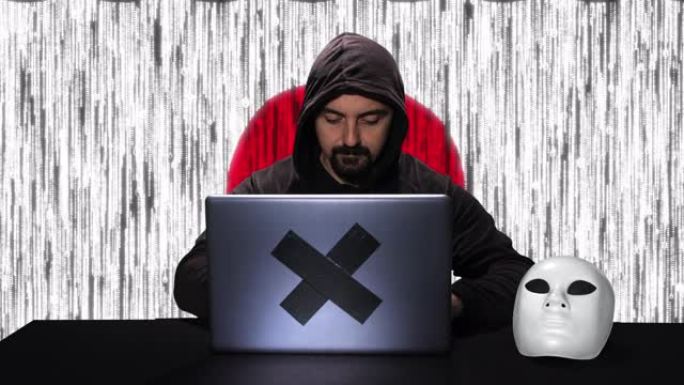 黑客在带有日本国旗的笔记本电脑上键入代码黑客，背景中有代码动画覆盖