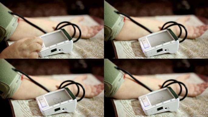 测量血压的成年女性。成年后的医疗保健