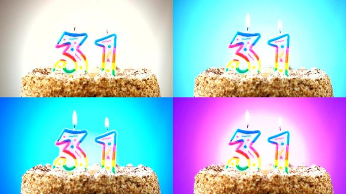 带有燃烧的生日蜡烛的生日蛋糕。31号。背景改变颜色