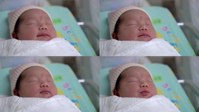 熟睡的亚洲新生婴儿特写肖像，4k手持镜头。真正的现场直播