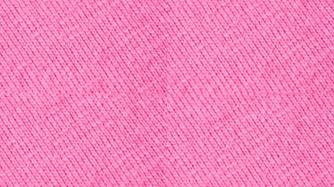 纺织背景-粉红色100% 棉布与球衣 (stockinette) 结构。