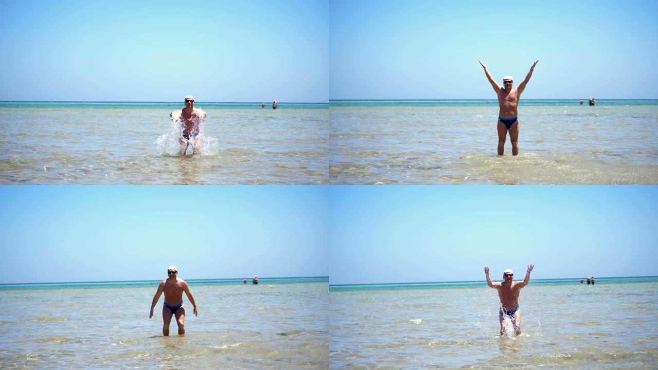 一个穿着泳裤，戴着墨镜和西装外套的男人站在浅水中，在阳光的照射下飞溅。他在温暖的夏日晒日光浴，在海上