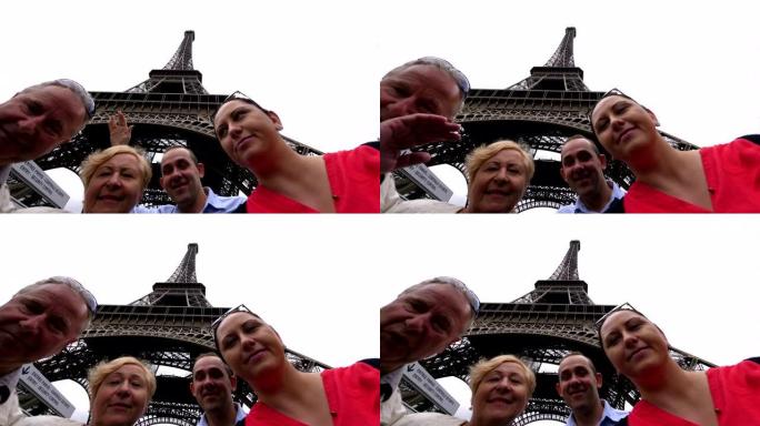 快乐的家庭在巴黎埃菲尔铁塔下玩得开心，并以4k慢动作60fps发送问候