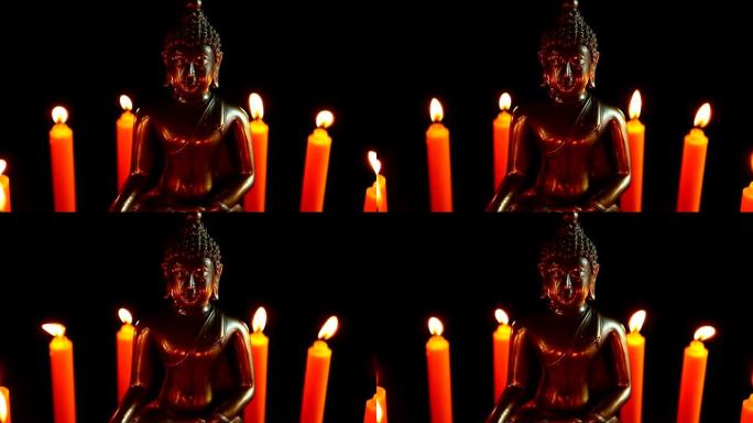 黑暗中的佛像和蜡烛