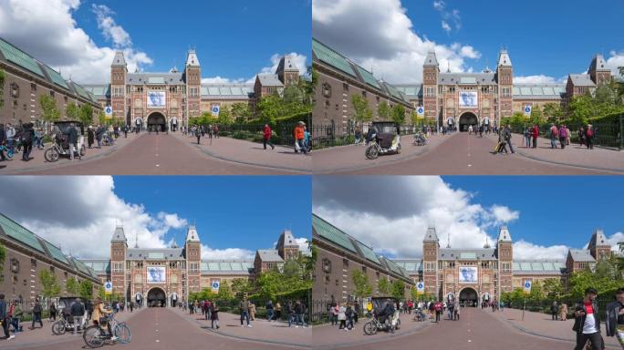 阿姆斯特丹市的人们以国家博物馆为背景，荷兰阿姆斯特丹市的荷兰国家博物馆