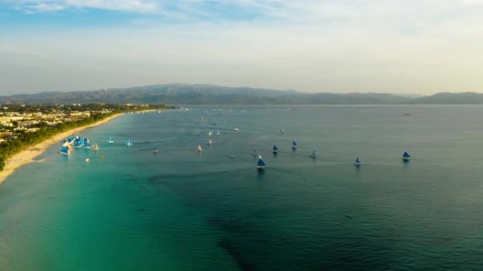 菲律宾长滩岛热带海滩和帆船。时间流逝
