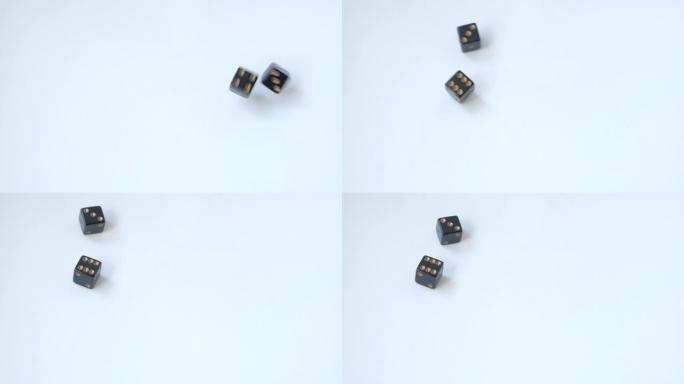 在慢动作的白色桌子上用一对黑色赌博骰子滚动三个和六个