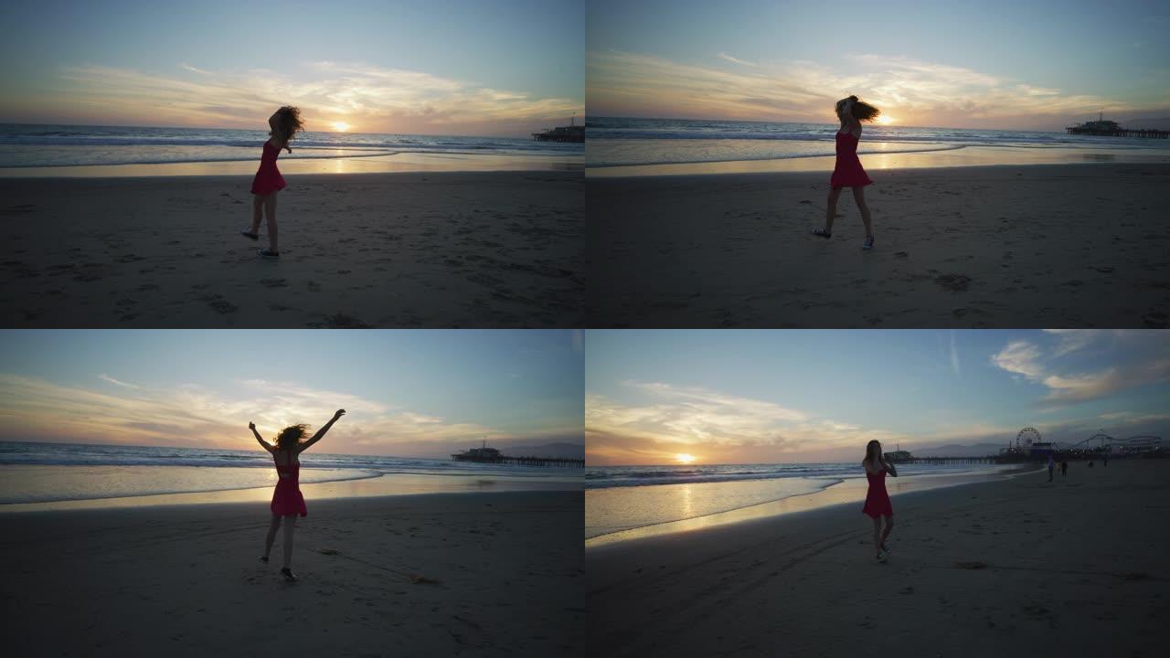 日落时分，圣莫尼卡海滩上热情的女孩