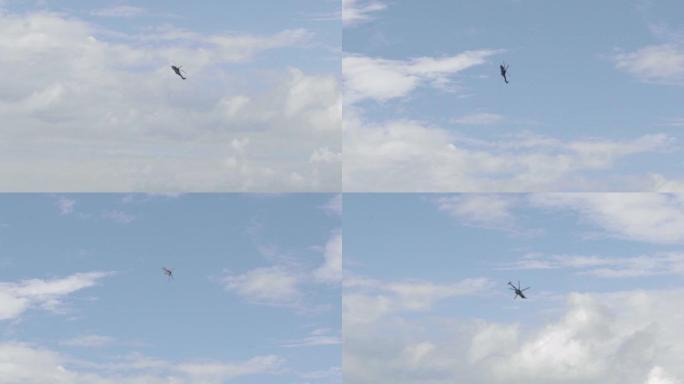 直升机在海滩的蓝天中慢动作循环。4K。