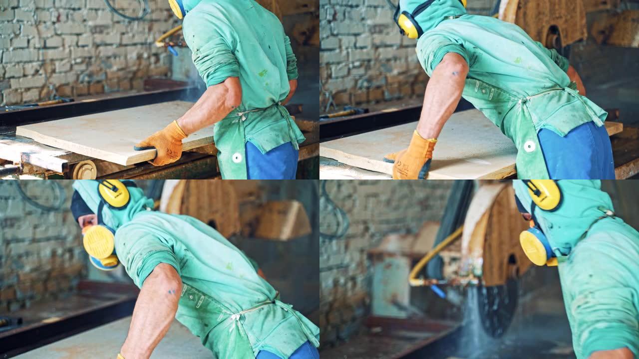 石材数控机床工人在石材厂切割板材。