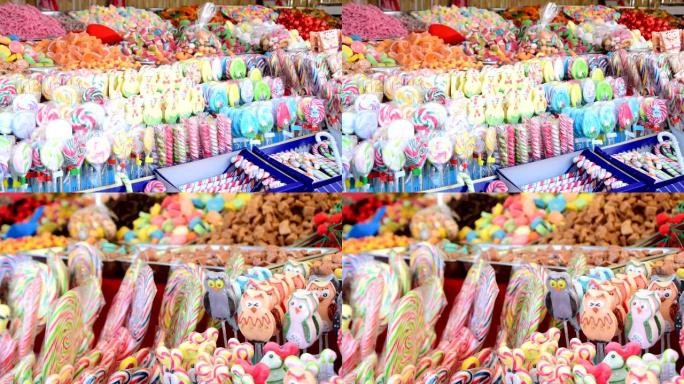 博览会上有五颜六色的糖果和棒棒糖的摊位上的糖果