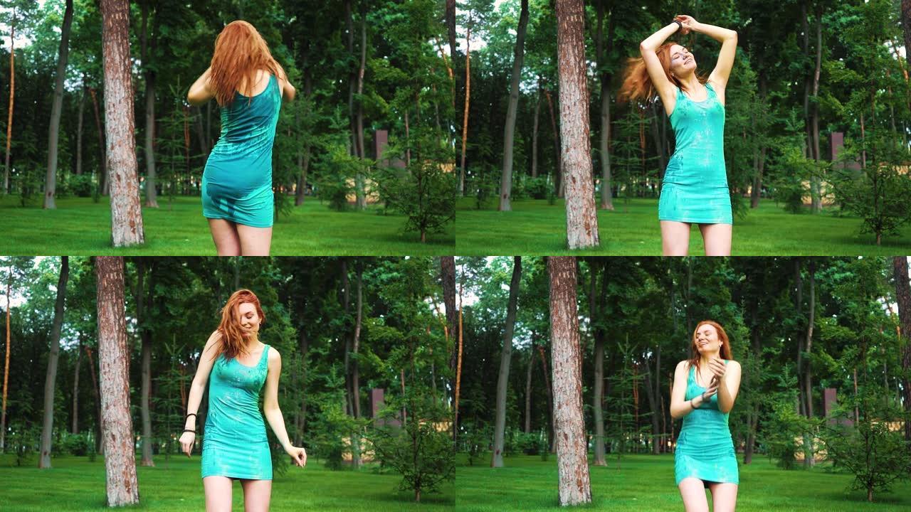 胡里红头发的女孩在绿色公园画慢动作舞蹈