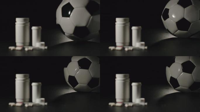 慢动作: 用药丸在白盒旁边滚动的足球球