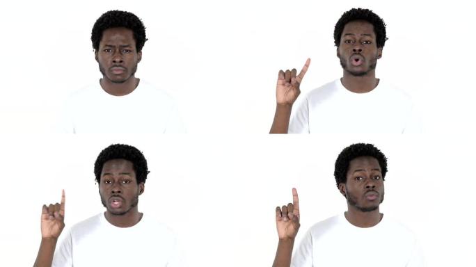年轻的非洲男子挥舞着手指拒绝在白色背景上隔离