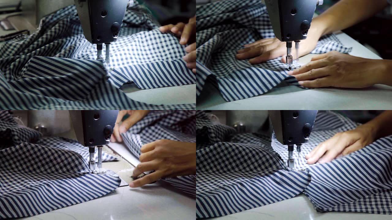 特写裁缝在包缝机上包边做衣服。