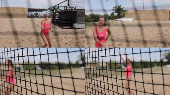 十几岁的女孩在暑假玩沙滩凌空抽射