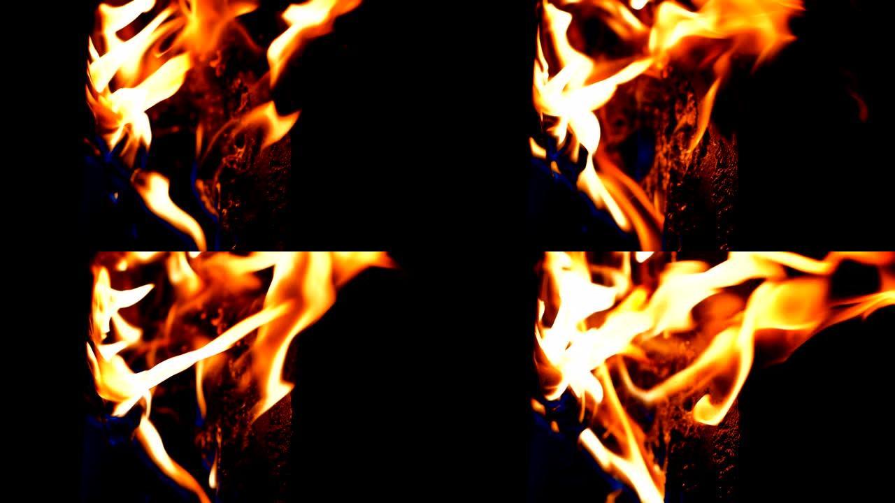 慢动作火焰在黑色黑暗背景上燃烧，热和热危险