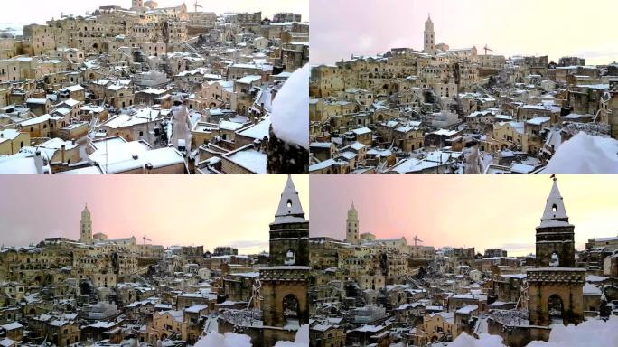 典型的石头马泰拉Sassi di Matera和马泰拉教堂2019年与雪的房子，旅游的概念和圣诞假期